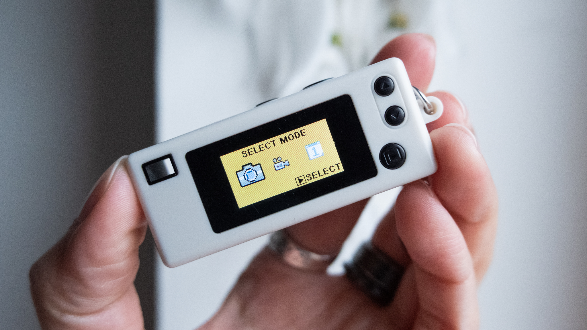 A photo of a Kodak Charmera keychain camera