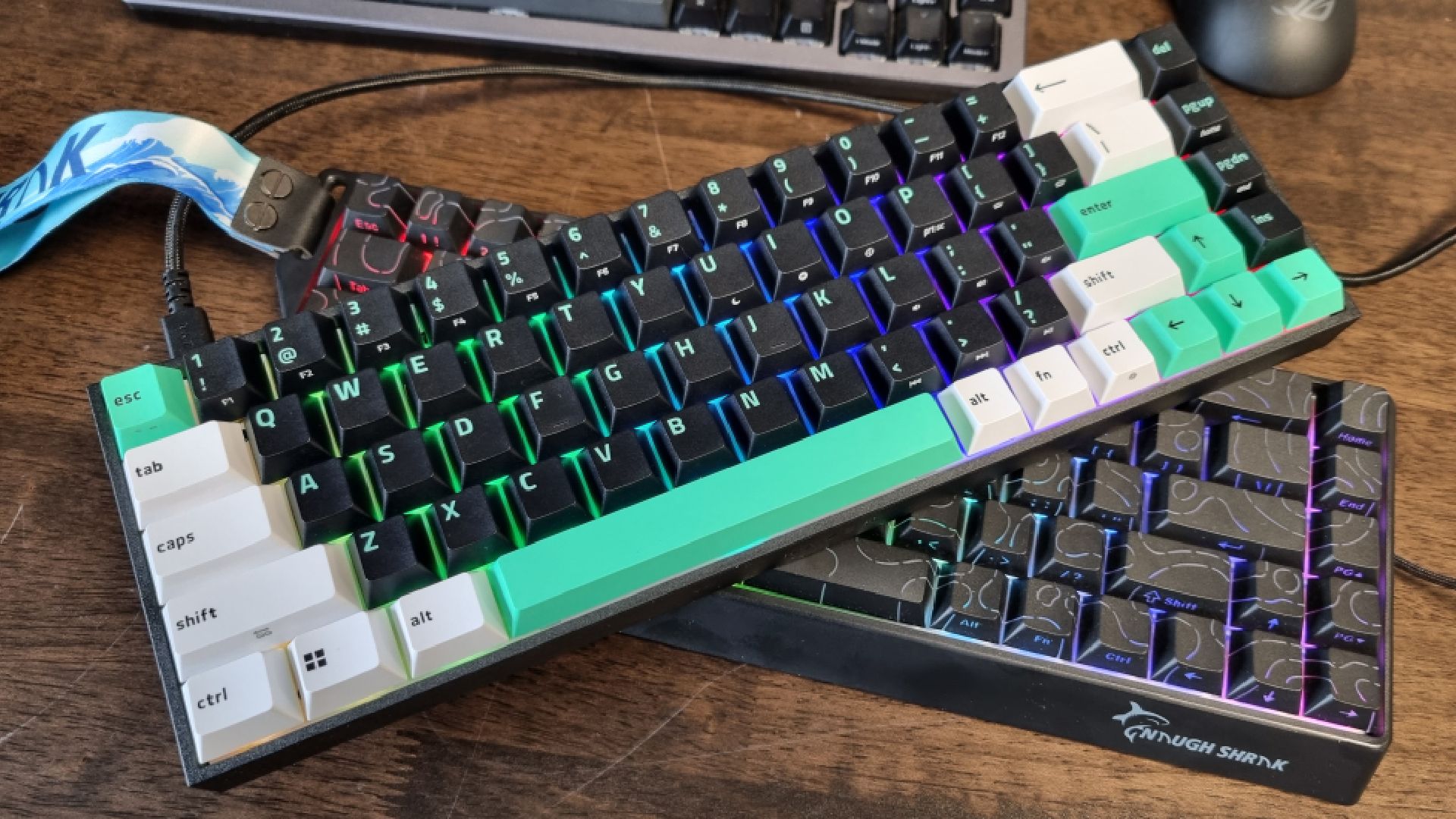 A Razer Reclusa X Mini 65% on top of a Gamakay x NaughShark NS68
