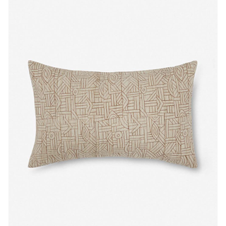 beige lumbar pillow with brown geometric line design