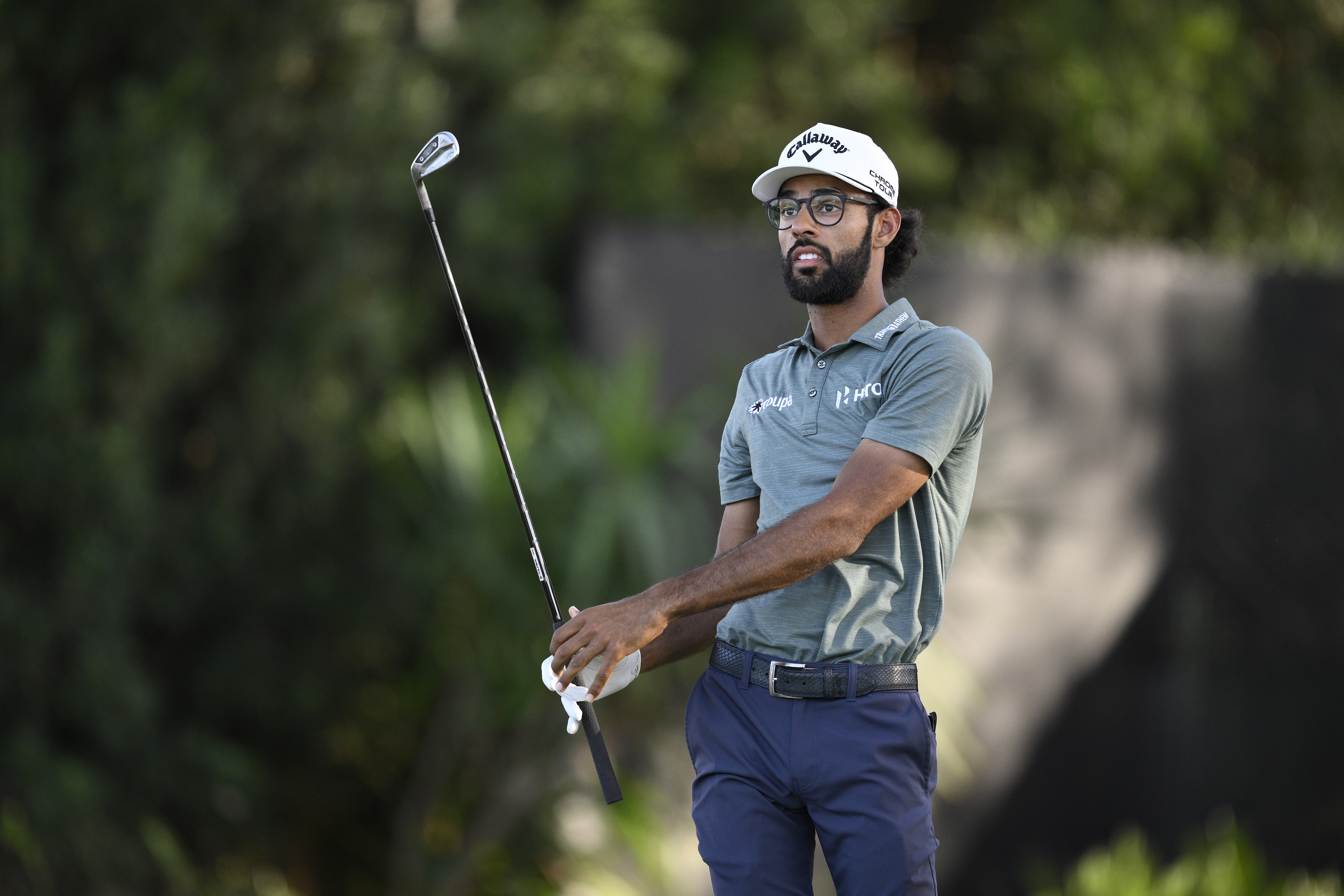 Akshay Bhatia hits an iron shot