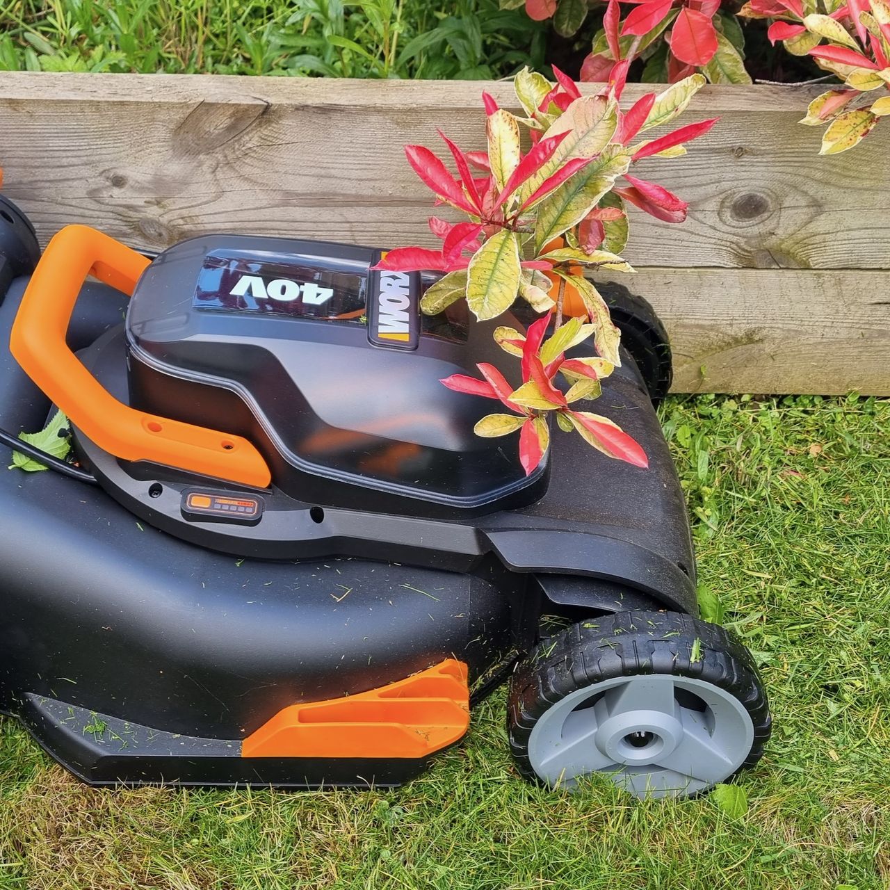 Worx lawn mower cutting border by raised bed