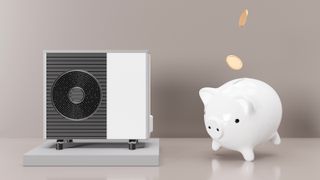model of heat pump with white piggy bank next to it and coins falling in