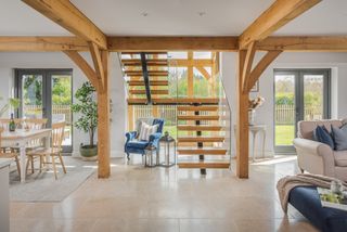 Modern staircase in oak frame home