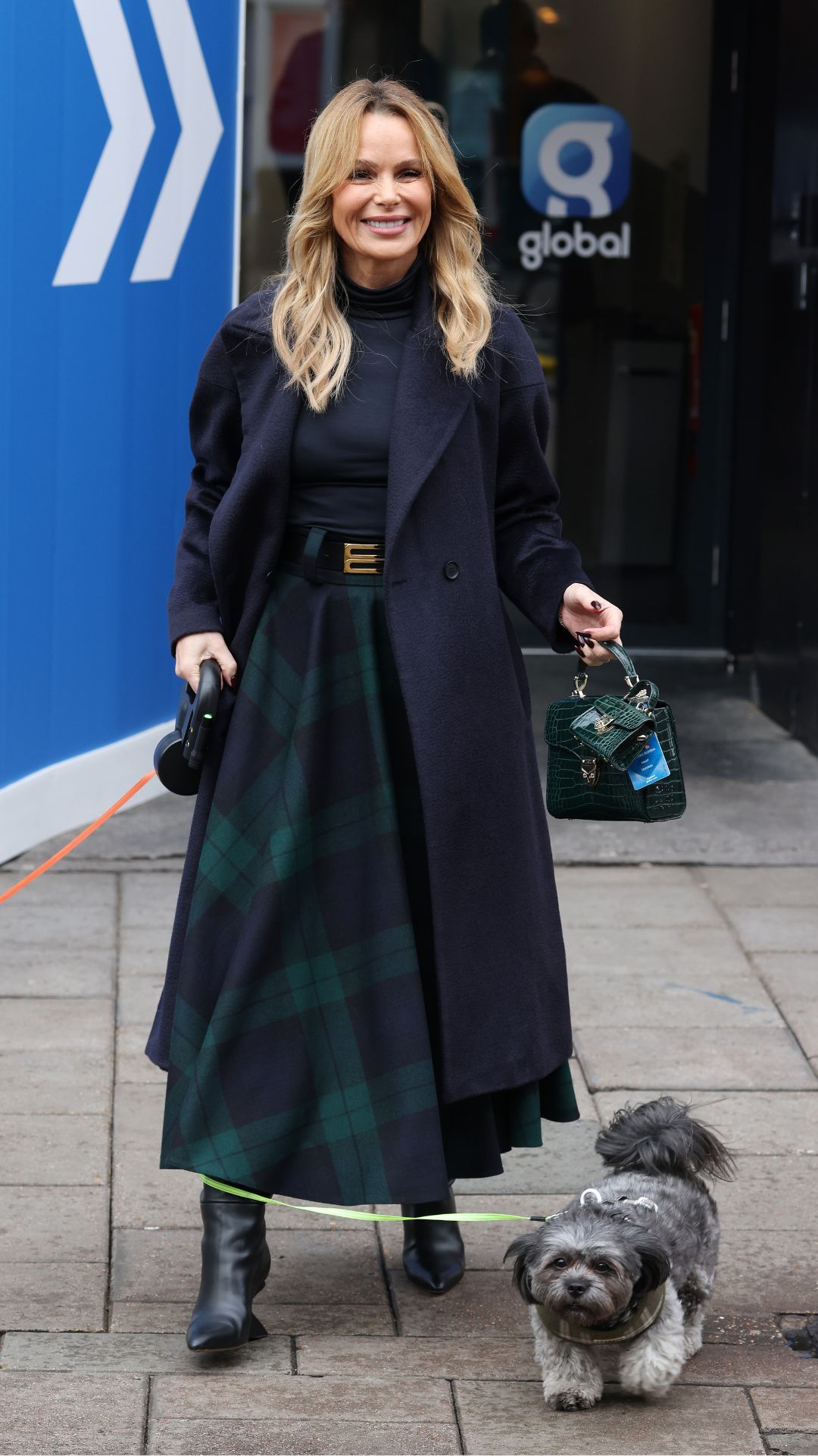 amanda holden wearing a tartan skirt and navy coat