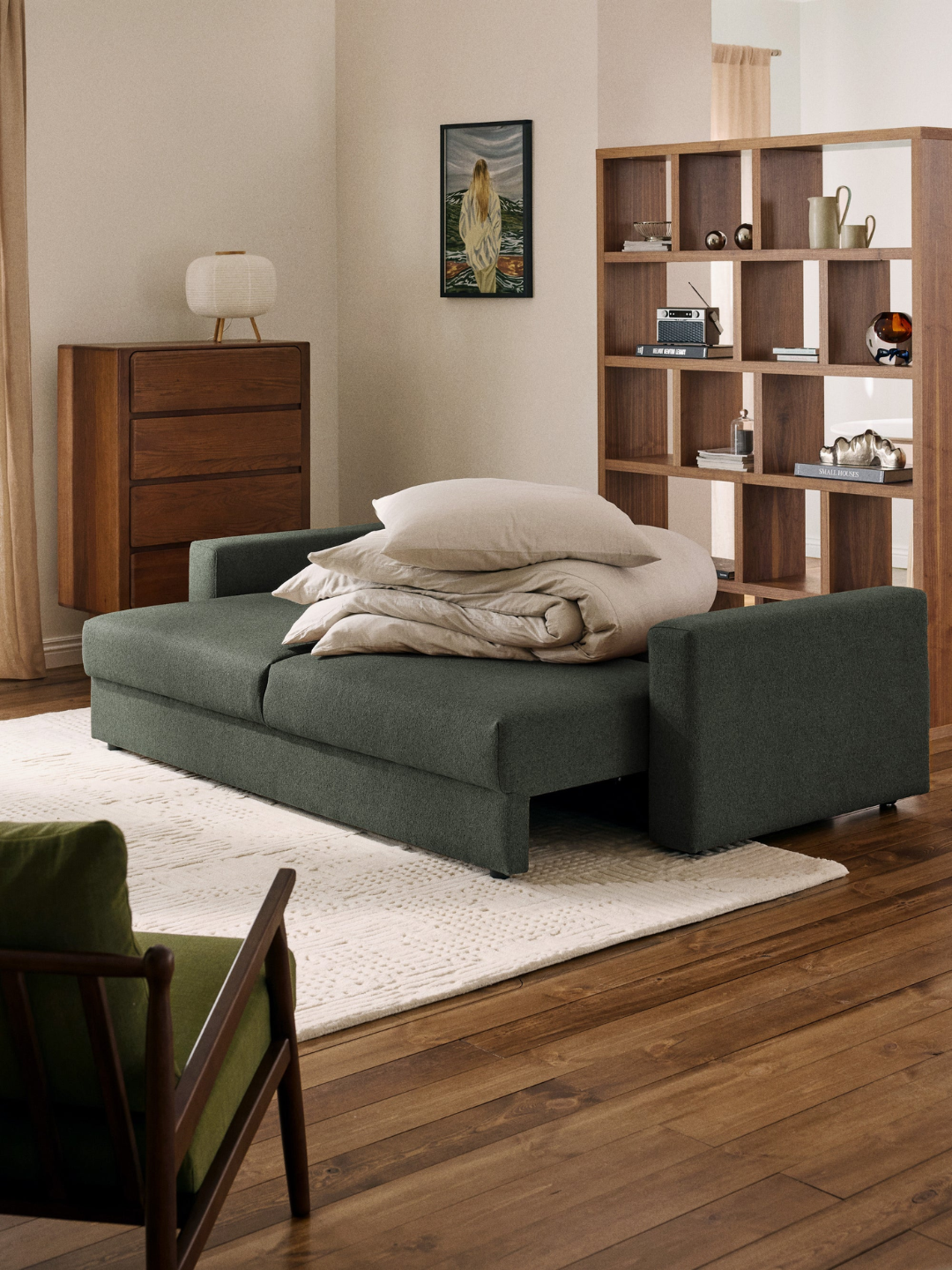 A green boucl&amp;eacute; three-seater sofa bed from Westwing
