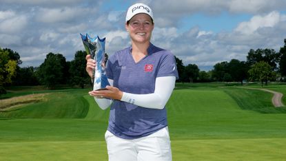 Ally Ewing holds the trophy after she won the 2022 Queen City Championship in Ohio