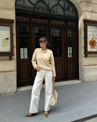 French fashion influencer Julie Sergent Ferreri wearing a chic fall sweater outfit in Paris.