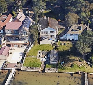 An overhead shot of Harry Redknapp's home on the beach with a large back garden and boat house