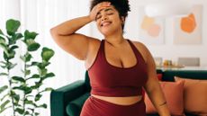 Plus-size woman in gymwear smiling