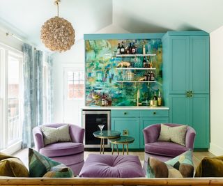 Bar room with teal cabinets and purple seating