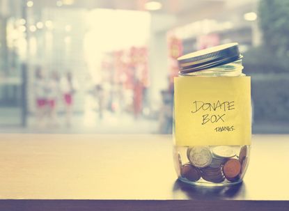 Donation box, coin in the glass bottle, vintage color tone