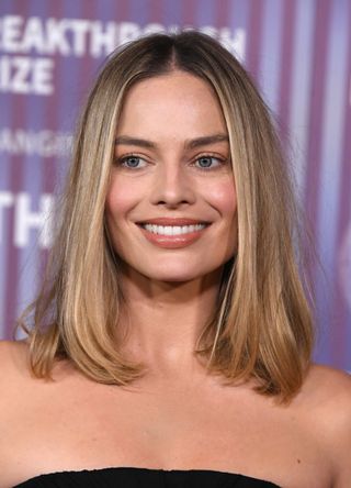 Margot Robbie arrives at the 10th Annual Breakthrough Prize Ceremony at Academy Museum of Motion Pictures on April 13, 2024 in Los Angeles, California