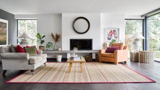 living room with wooden floor and sisal rug