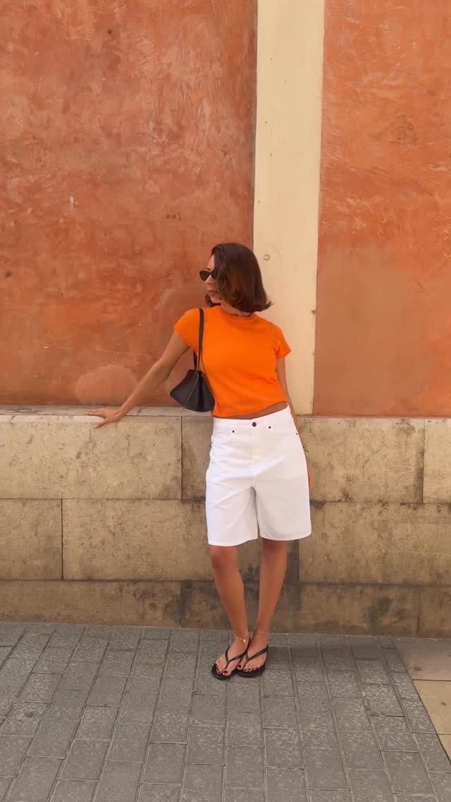 Woman wearing summer 2026 outfit featuring the colorful t-shirt trend.