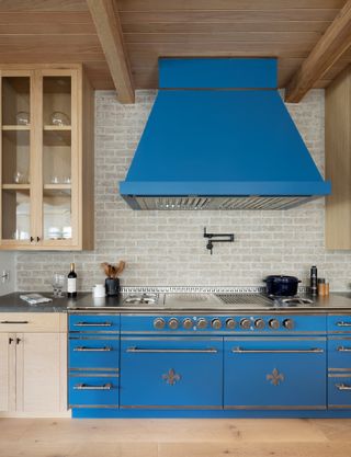 blue cooking range in neutral kitchen