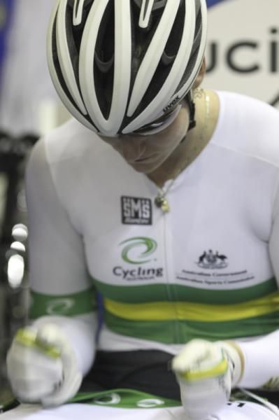 Meares thumps her legs ahead of the sprint semi against Pendleton.