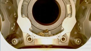 This image of pebble-size debris in the bit carousel on NASA’s Perseverance Mars rover was acquired on Jan. 7, 2022, by the rover's WATSON camera. The image was taken to assist the Perseverance team in diagnosing an anomaly that occurred during a rock sampling on Dec. 29, 2021.