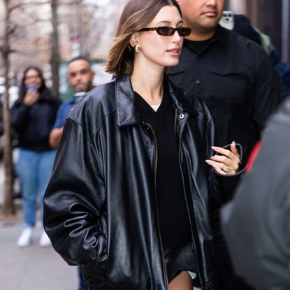 Hailey Bieber wears gold earrings