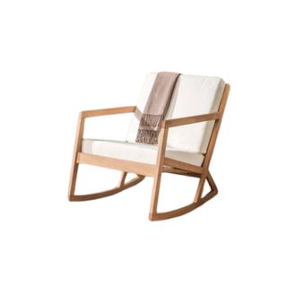 Outdoor wooden rocking chair with white cushions