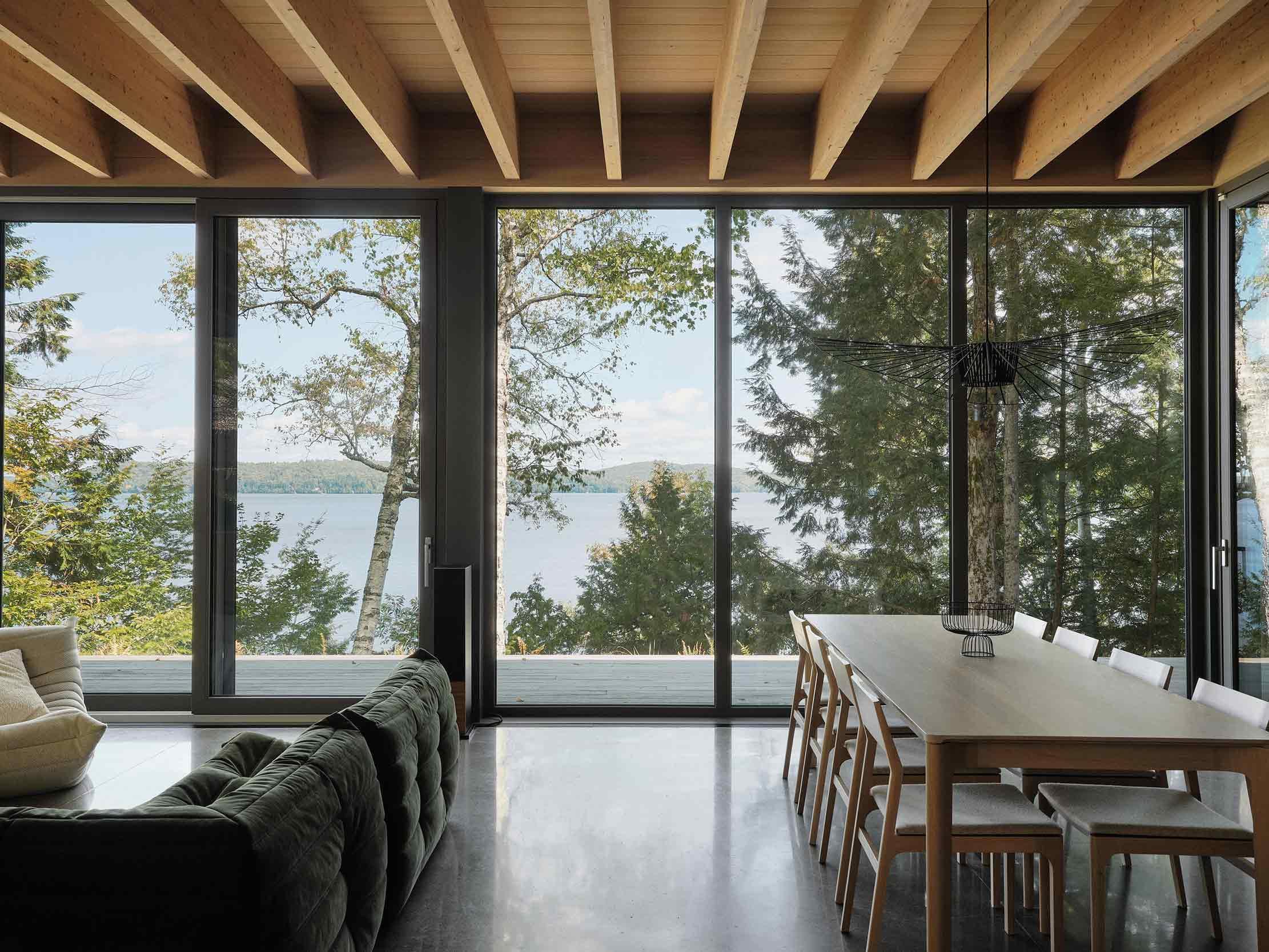 The expansive open plan living area has lake views throughout