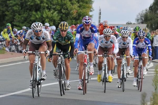 The riders line out across the road