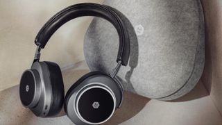 Master & Dynamic MW75 headphones in black with gray carry case