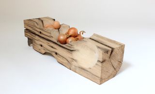 Handcrafted wooden bowl shaped like block of wood