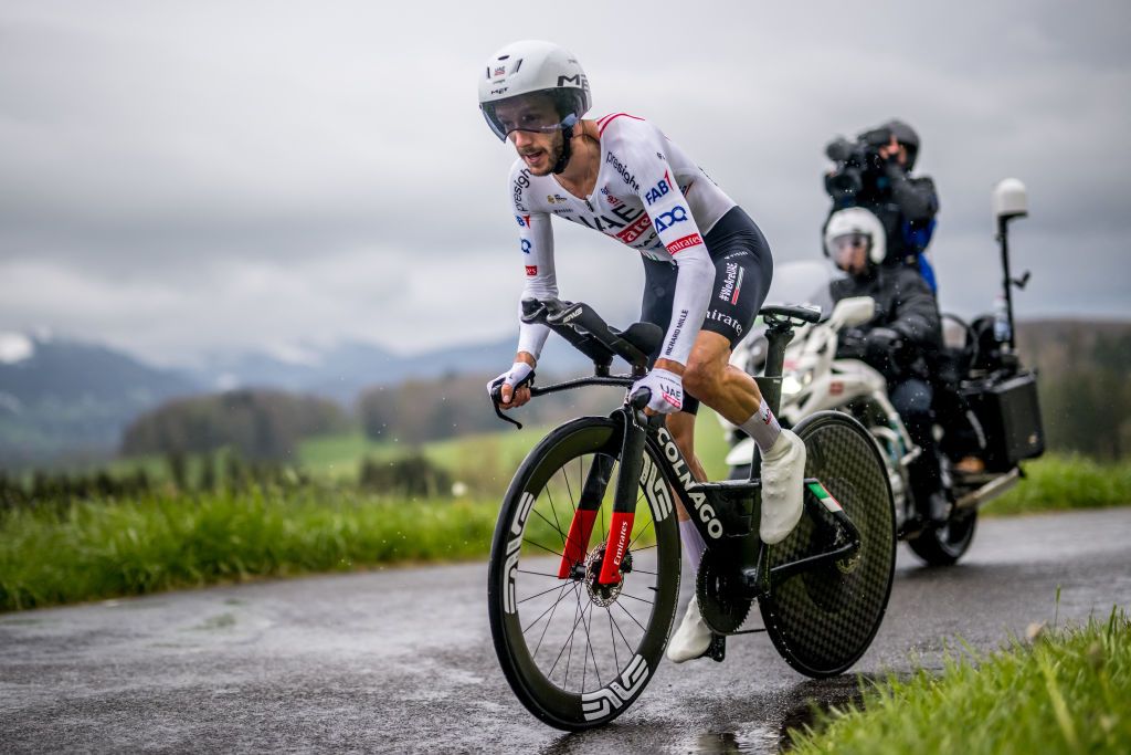 UAE Team Emirates' British rider Adam Yates cycles during the third stage of the Tour of Romandy UCI cycling World tour, a 15.5 km time trial starting and finishing in Oron, western Switzerland, on April 26, 2024. (Photo by Fabrice COFFRINI / AFP)