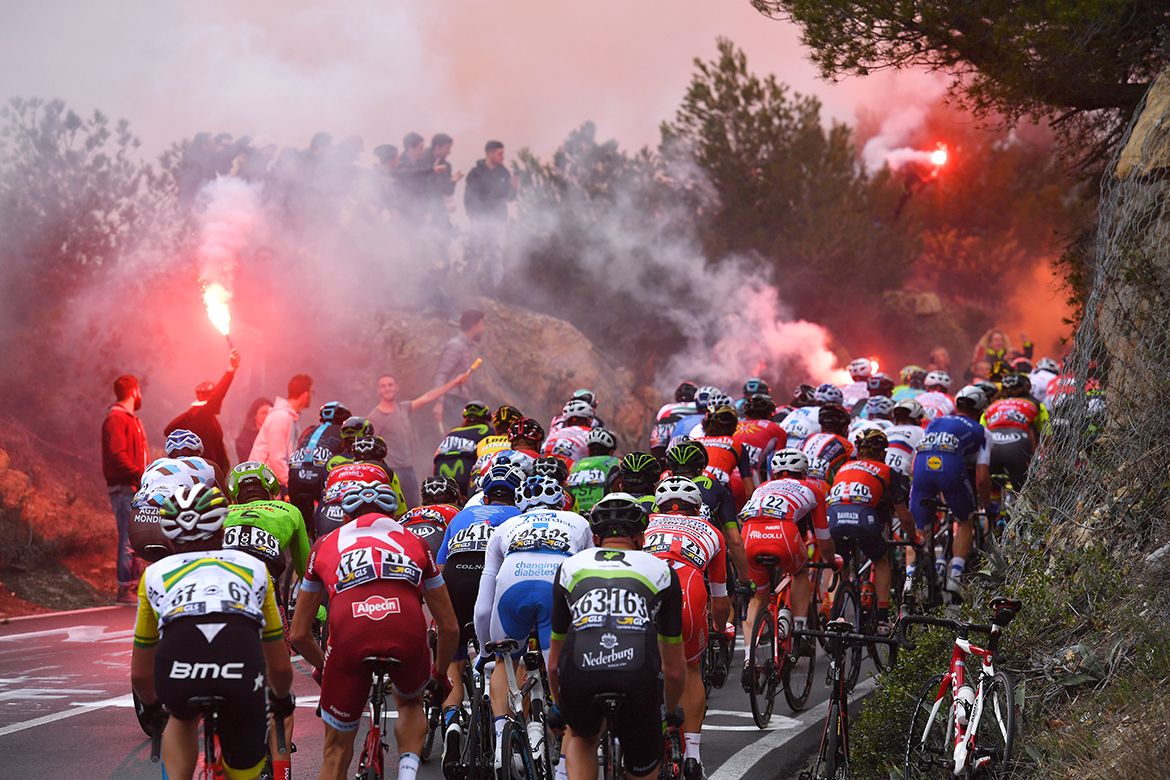 Fans burn flares on the Cipressa, quite unwelcome for riders breathing heavily