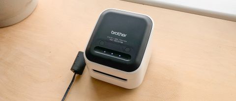 Brother VC-500W thermal printer on a wooden table