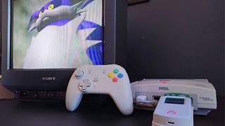 Sony Trinitron CRT TV with Big the Cat from Sonic Adventure on screen next to Sega Dreamcast with Retro Fighters controller.