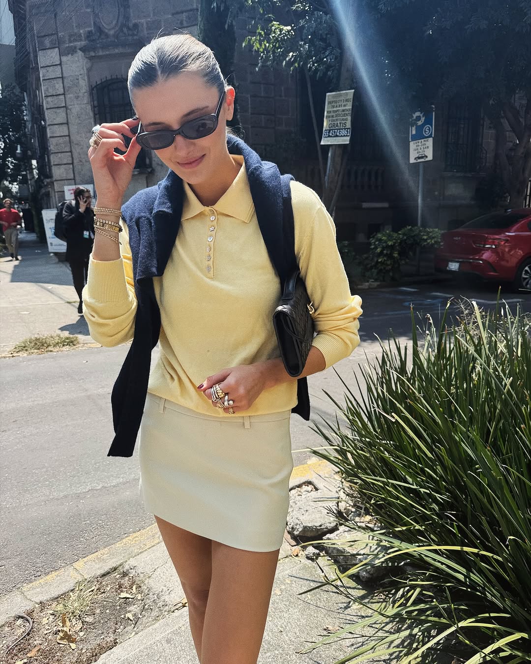 Woman wearing a sweater styling idea for 2025 in summer.
