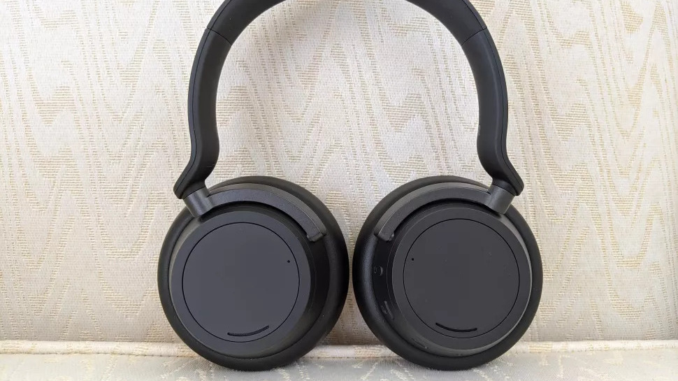 The Microsoft Surface Headphones 2 resting against a seat