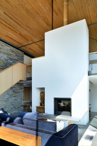 large chimney breast and fireplace in vaulted open room