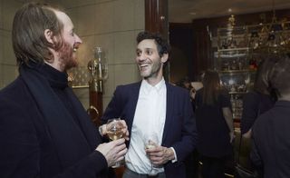 Two male guests pictured laughing together
