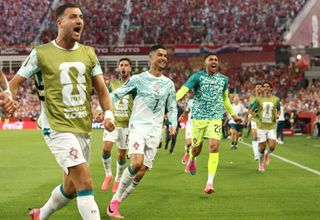 Cristiano Ronaldo celebrates with his Portugal teammates