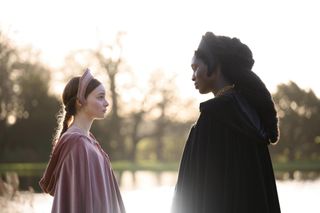Jane Seymour (Lola Petticrew) and Anne Boleyn (Jodie Turner-Smith) in conversation outdoors