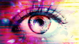 An eye overlaid with sharp-angled graphics and different colours like pink white and blue, all denoting a cyber element of surveillance such as spyware