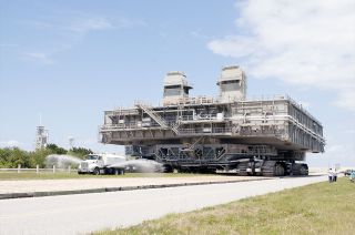 Mobile Launch Platform-2 (MLP-2) is seen being moved to a park site in the Launch Complex 39 area at NASA's Kennedy Space Center in Florida in May 2014. Between 1968 and 2011, MLP-2 was involved in the launch of 51 Apollo and shuttle missions.