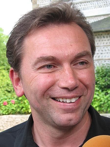 Belgian Bruyneel has plenty to smile about