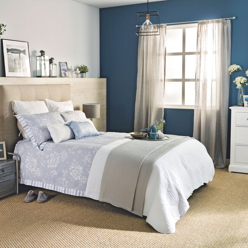 bedroom with sash window and lantern