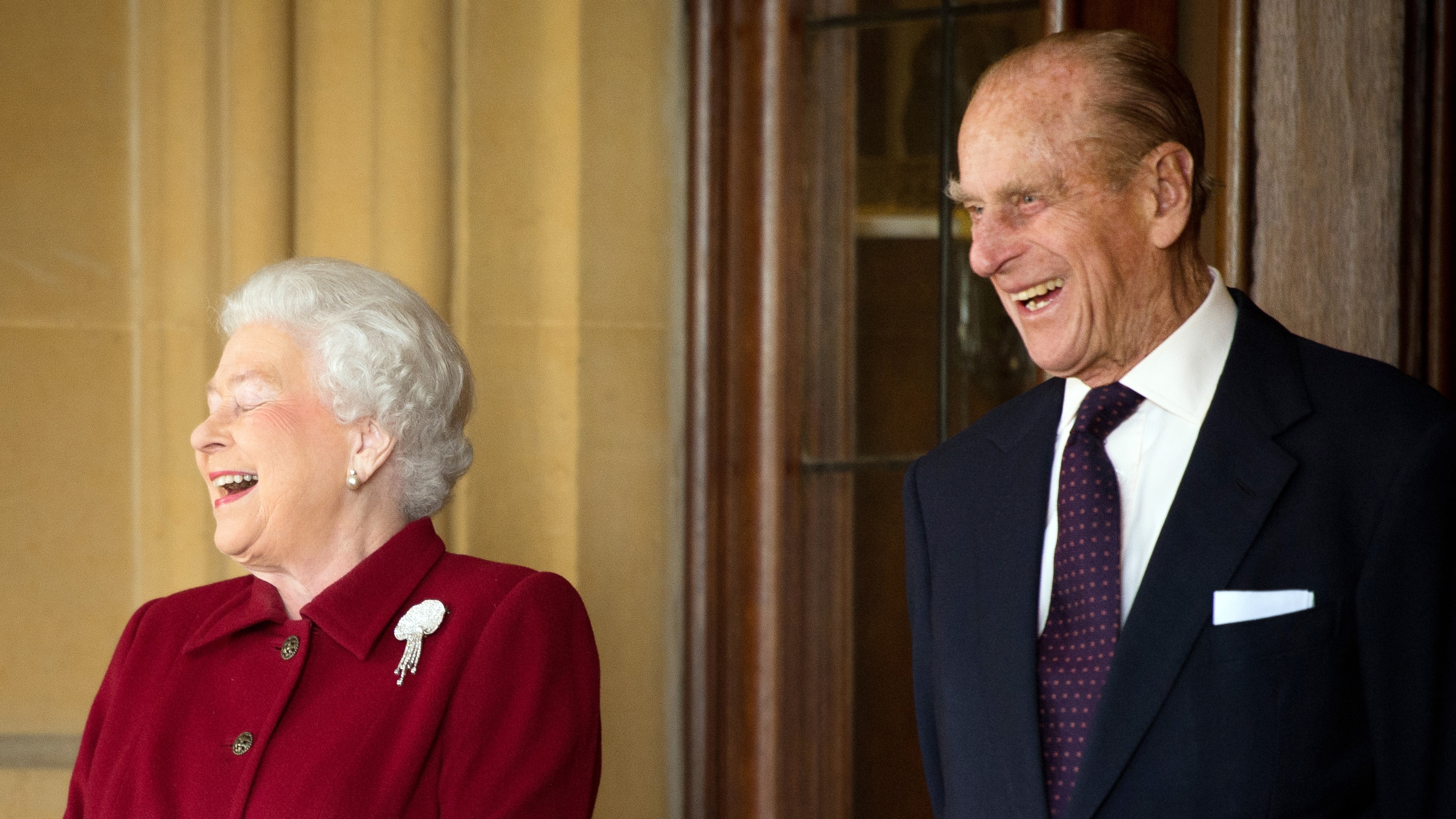 Queen Elizabeth II and Prince Philip, Duke of Edinburgh react as they bid farewell to Irish President Michael D. Higgins and his wife Sabina (not pictured)