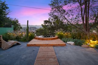 deck with jacuzzi at sunset