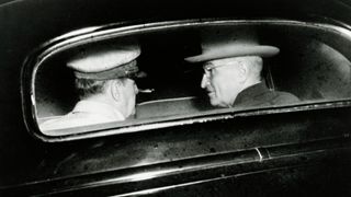 U.S. military commander General Douglas MacArthur (1880 - 1964) and U.S. President Harry S. Truman (1884 - 1972) as they talk in the back seat of a car in Wake Island, October 18 1950.