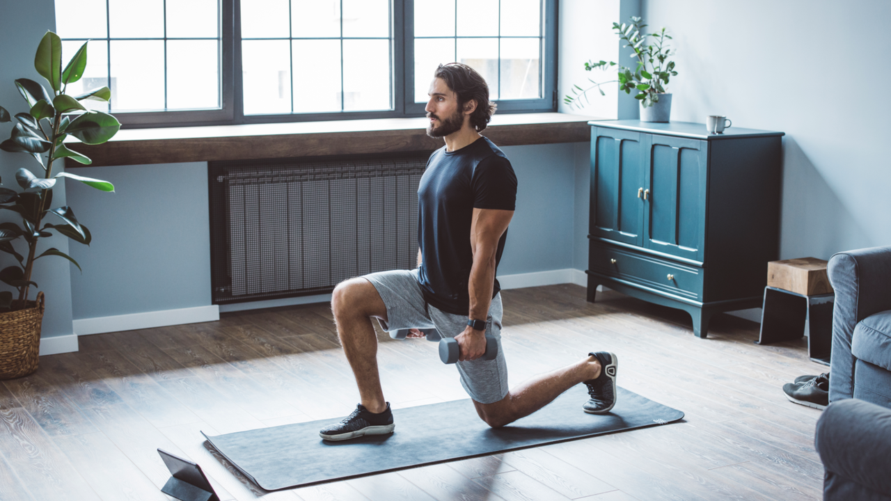 Man doing dumbbell lunges