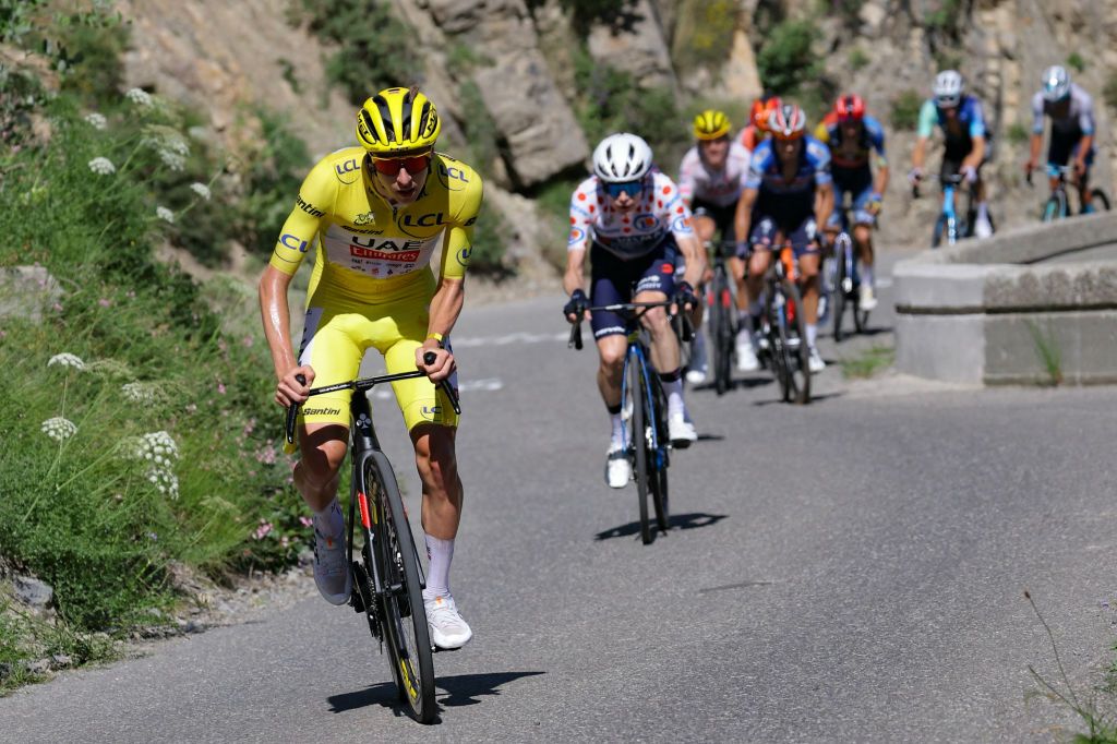 UAE Team Emirates team&#039;s Slovenian rider Tadej Pogacar wearing the overall leader&#039;s yellow jersey cycles ahead of Team Visma - Lease a Bike team&#039;s Danish rider Jonas Vingegaard in the ascent of Col du Noyer during the 17th stage of the 111th edition of the Tour de France cycling race, 177,8 km between Saint-Paul-Trois-Chateaux and Superdevoluy, in the French Alps, on July 17, 2024. (Photo by Thomas SAMSON / AFP)