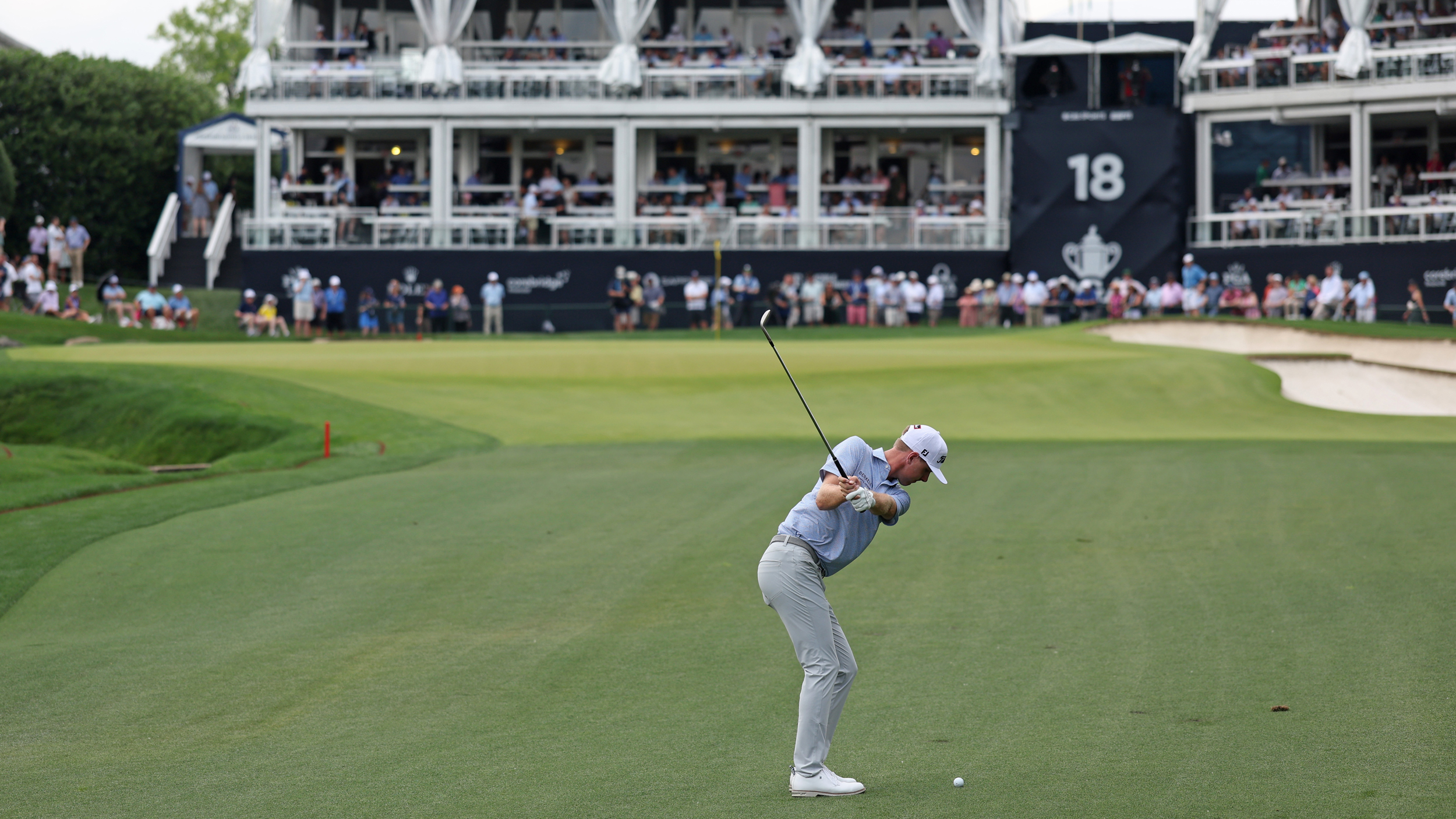 Ryan Gerard plays an iron shot into the 18th at the PGA Championship