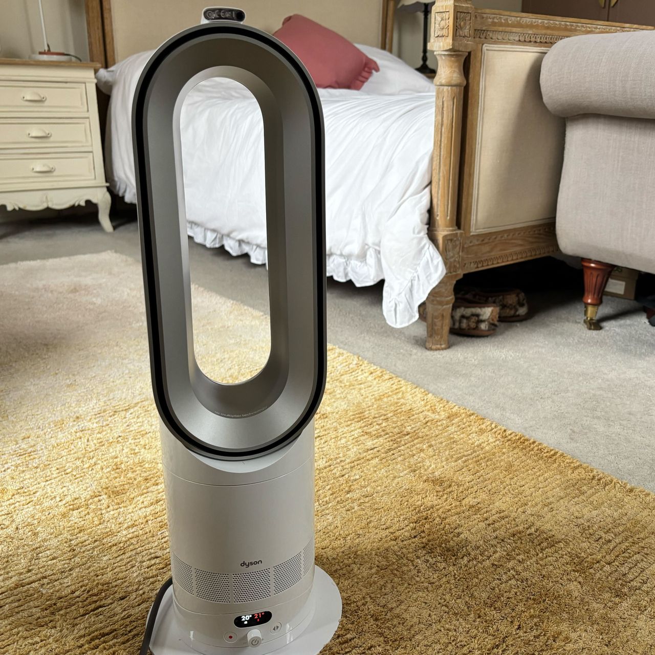 dyson hotcool pre heat heater and cooling fan in a bedroom