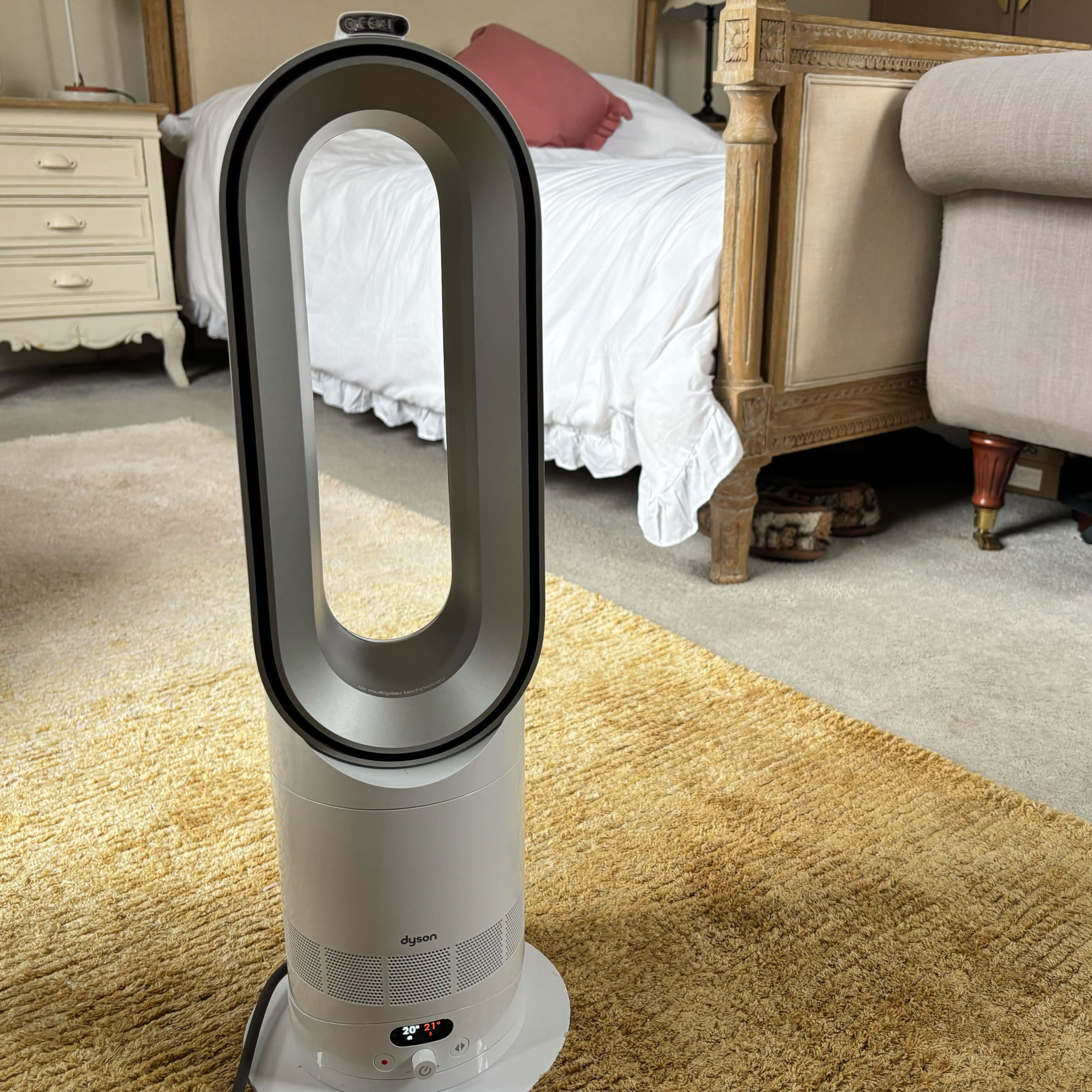 dyson hotcool pre heat heater and cooling fan in a bedroom
