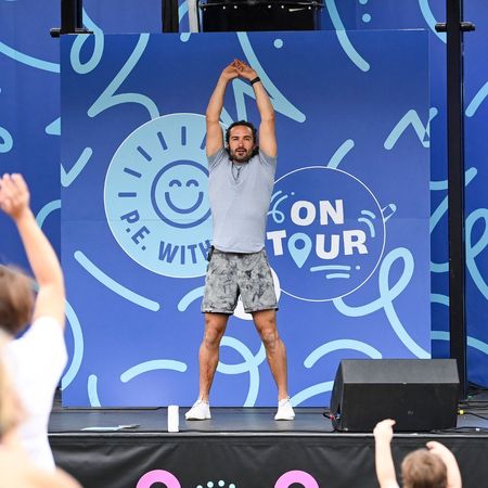 Joe Wicks workouts: The personal trainer performing a workout on stage